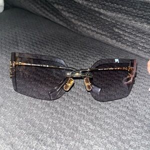 Miu Miu Light Grey rimless sunglasses